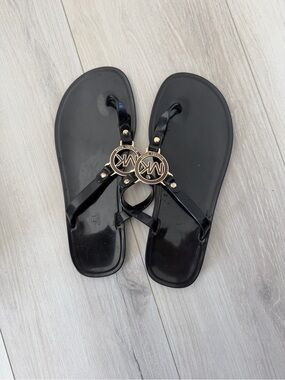 Michael Kors Black Jelly Logo Thong Sandals with Gold MK Medallions
